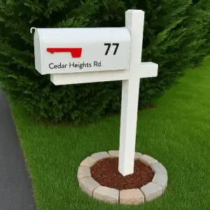 White mailbox with red flag, green background.